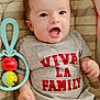 Dastan participe au concours pour gagner de l'argent avec cette photo : baby, infant, smiling, clothing, tshirt, toy, colorful, cushion, indoor, person, child, happy, cute, mouth_open, face, head, skin, hand, fabric, lying_down