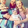 family, child, baby, toddler, man, woman, indoor, portrait, smile, clothing, headband, beard, casual, holding, light_fixture, happy, people, parent, childcare, love
