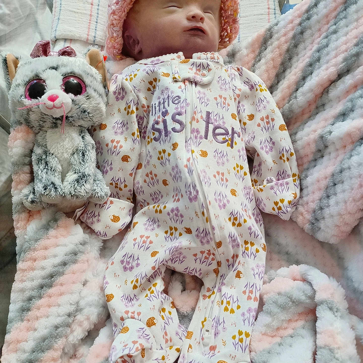 Ariella joined the competition — help win amazing prizes! baby, bed, blanket, bonnet, cap, clothing, couch, crib, face, furniture, hat, head, infantbed, newborn, person, photography, portrait, quilt, sleeping, toy