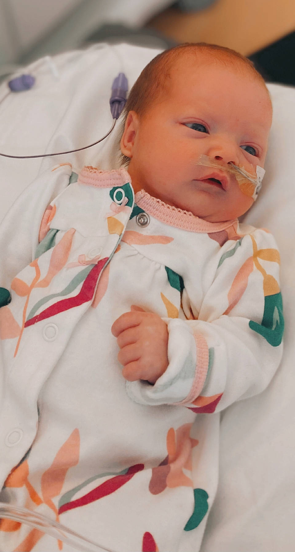 Mckinley is registered to the contest to win money with this photo: arm, baby, baby_products, baby_toddler_clothing, cheek, child, collar, comfort, event, eye, face, happy, linens, person, product, service, skin, sleeve, stethoscope, thumb