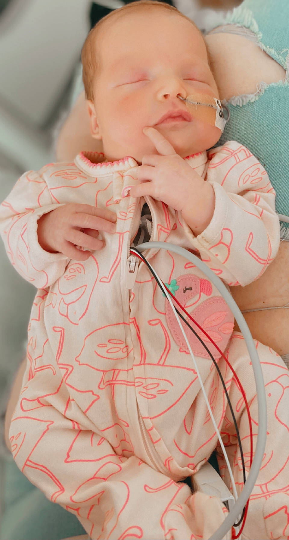 Mckinley is registered to the contest to win money with this photo: arm, baby, baby_toddler_clothing, cheek, child, comfort, drinkware, event, eyelash, finger, lip, medical_equipment, neck, organ, person, pink, skin, sleeve, textile, toddler