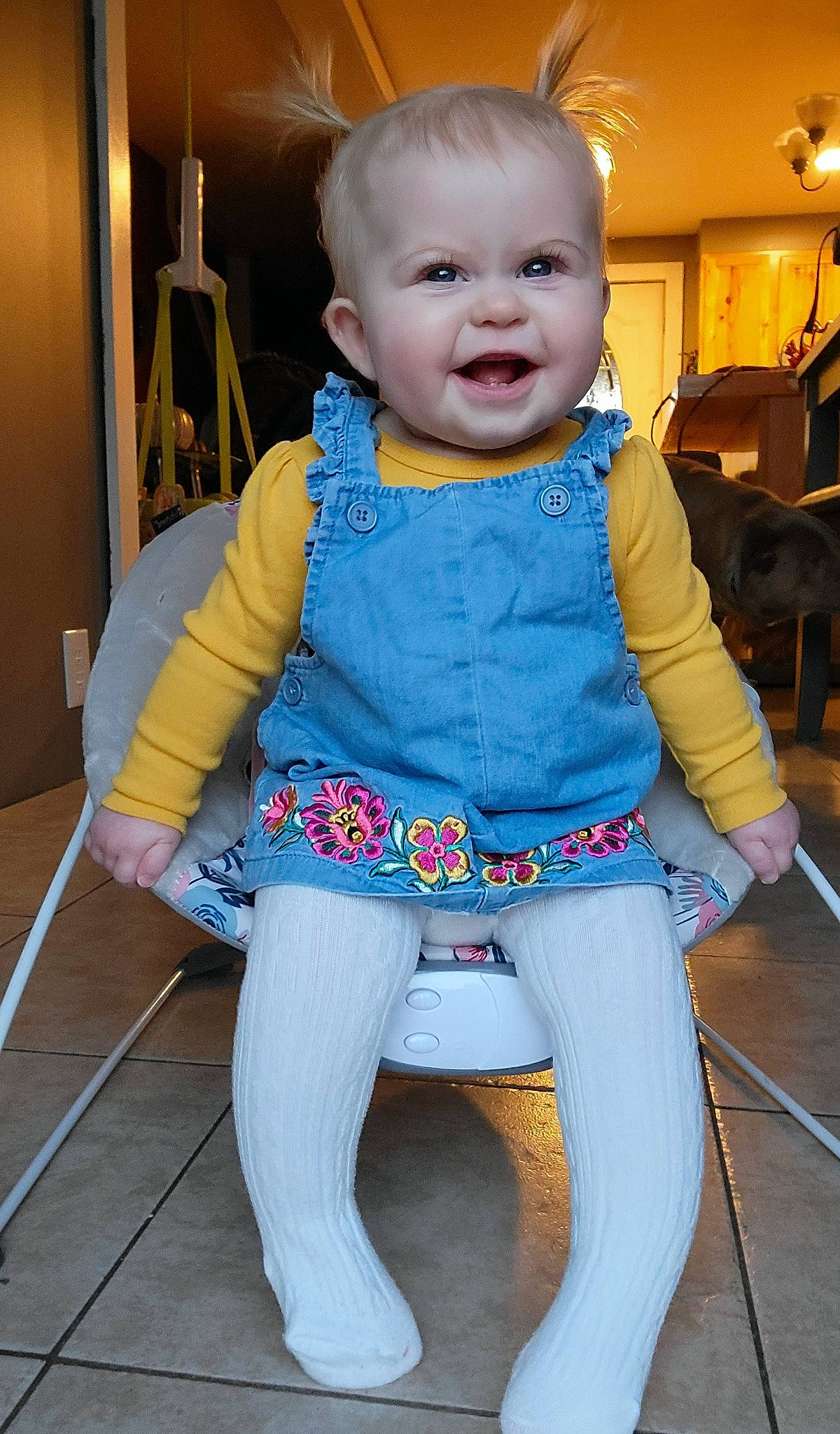 Rylee is registered to the contest to win money with this photo: baby, baby_toddler_clothing, cheek, child, electric_blue, eye, floor, flooring, happy, head, iris, nose, person, purple, skin, sleeve, smile, standing, textile, toddler