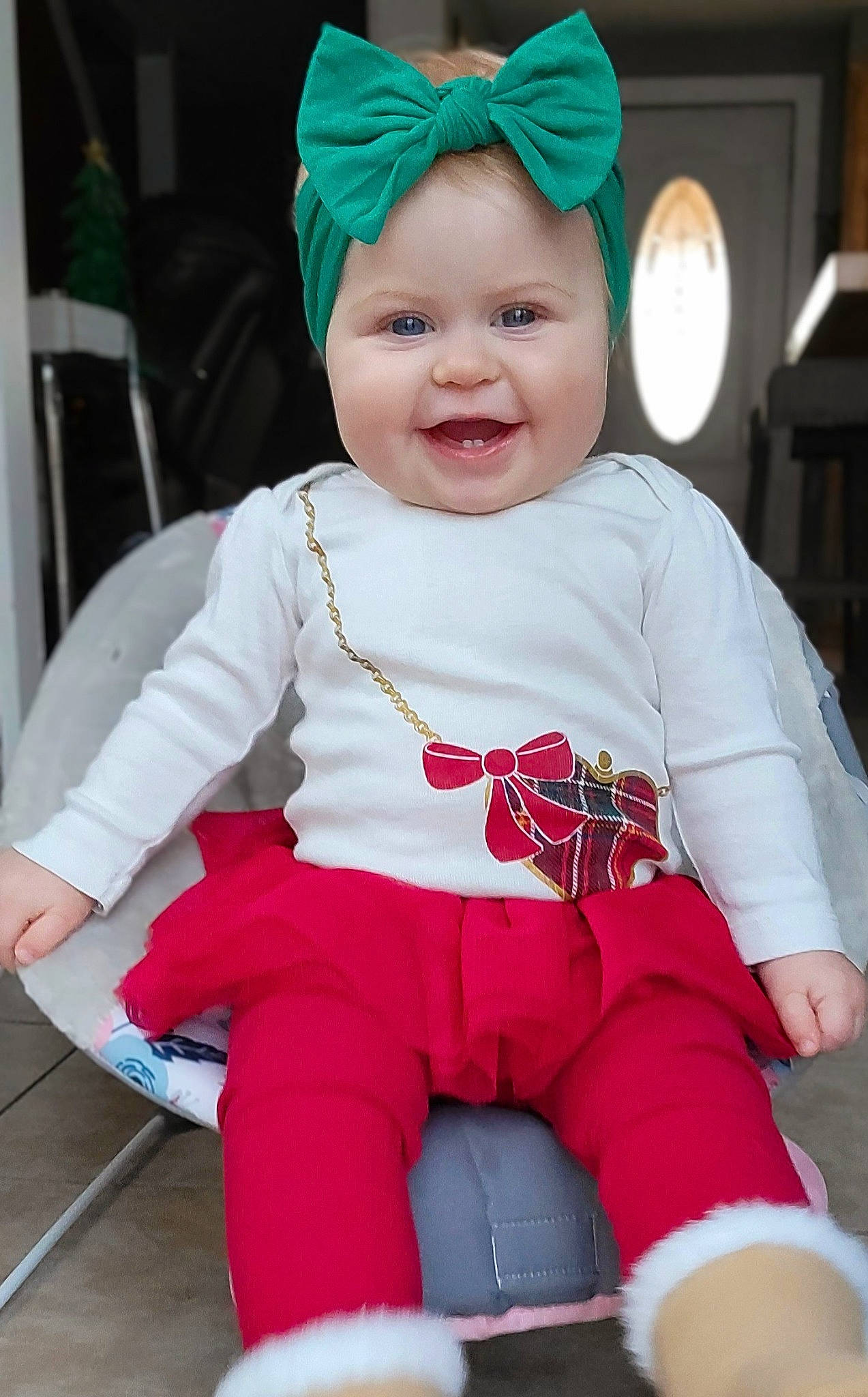Rylee joined the competition — help win amazing prizes! baby, baby_toddler_clothing, beauty, blue, cap, costume_hat, event, face, facial_expression, fun, green, happy, headwear, joy, lap, outerwear, person, pink, red, sleeve