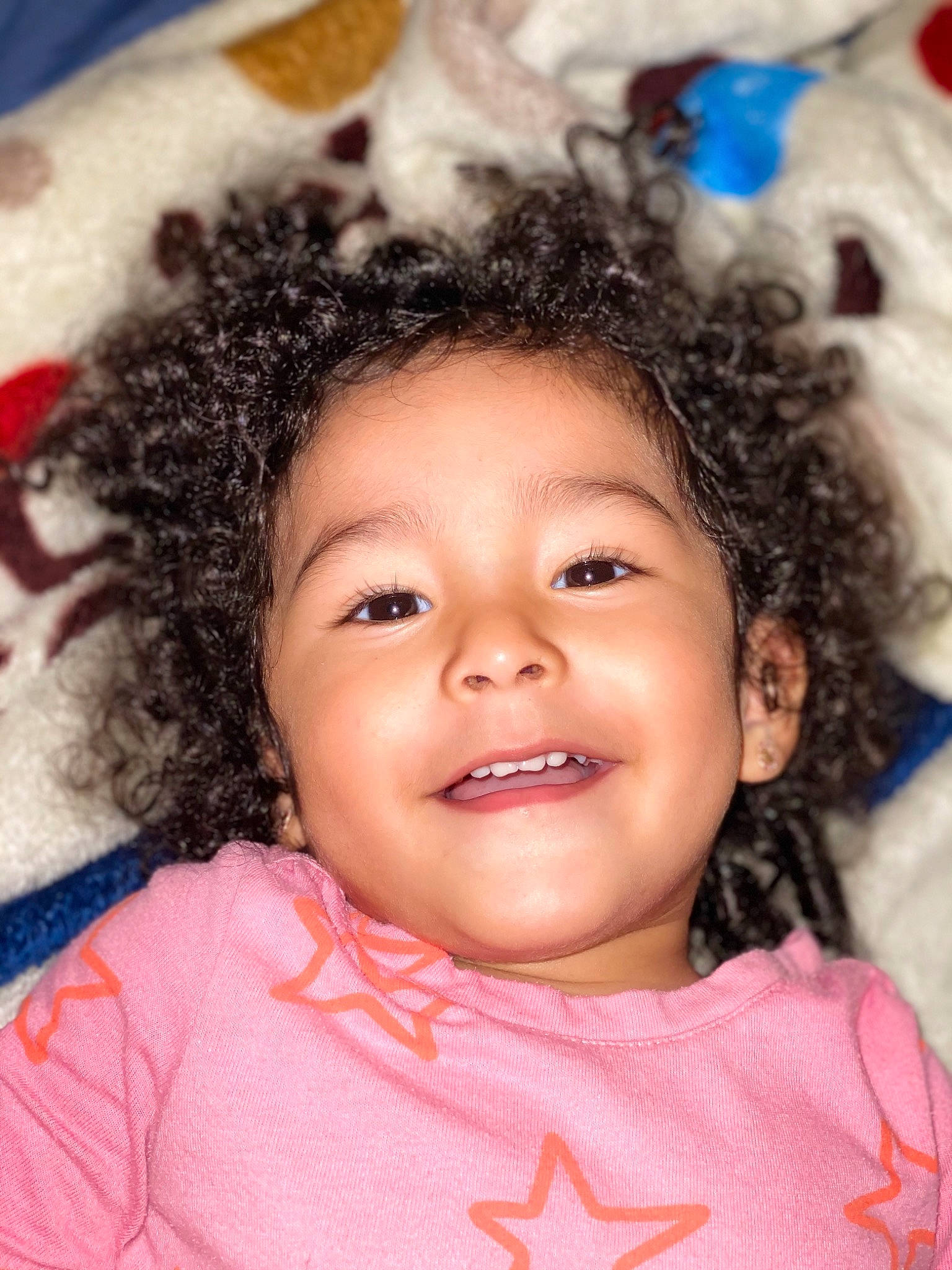 Gloria is registered to the contest to win money with this photo: baby_toddler_clothing, cheek, child, chin, eye, eyebrow, eyelash, facial_expression, forehead, hairstyle, happy, iris, joy, lip, mouth, nose, organ, person, pink, pleased