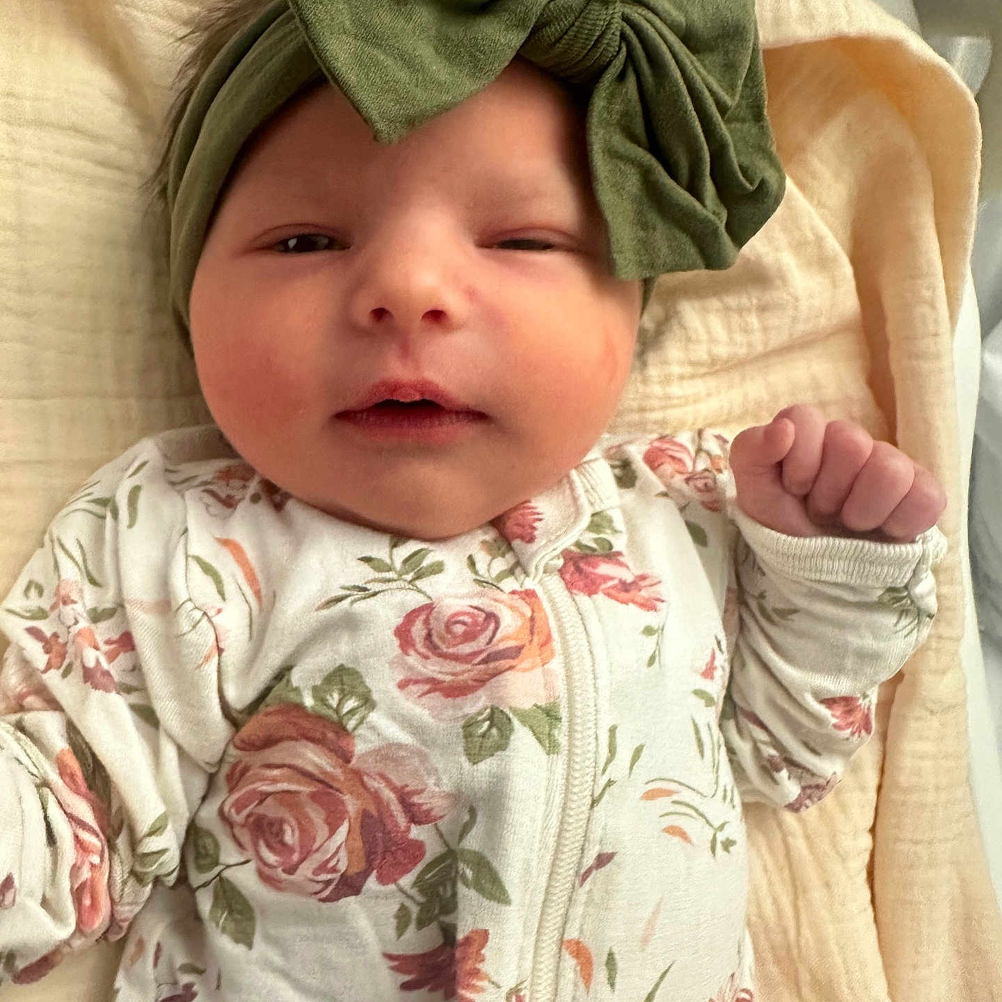 Presley is registered to the contest to win money with this photo: baby, infant, headband, bow, floral, onesie, blanket, sleepwear, cute, face, hand, skin, newborn, child, portrait, lying_down, soft, cozy, indoors, resting