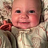 Tatum joined the competition — help win amazing prizes! baby, smiling, face, pacifier, pajamas, blanket, rosy_cheeks, cozy, infant, closeup, child, cute, happy, portrait, sleepwear, indoors, soft, warm, person, newborn