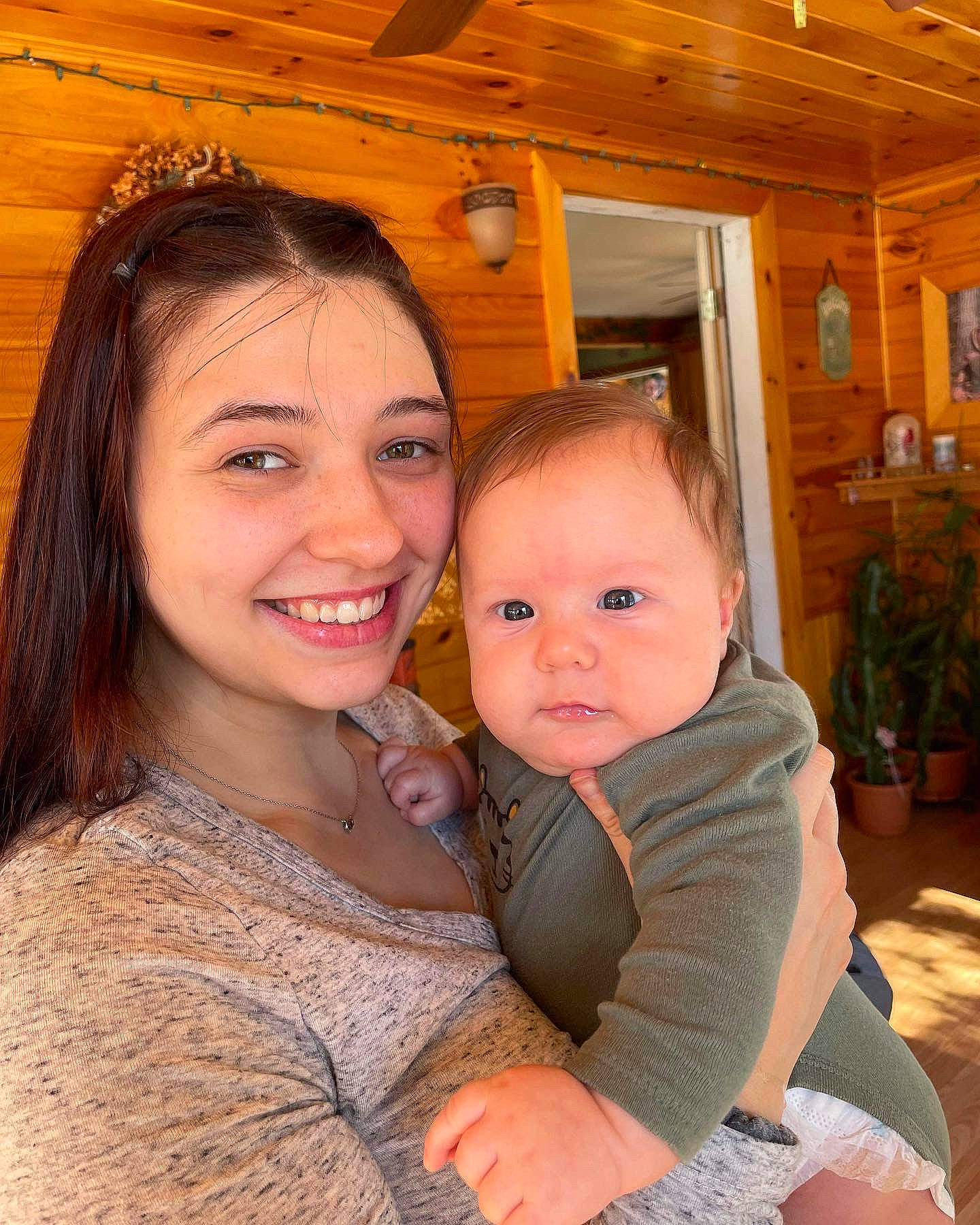 Luca is registered to the contest to win money with this photo: cheek, child, event, facial_expression, flowerpot, fun, happy, houseplant, iris, jewellery, joy, laugh, leisure, person, plant, sitting, skin, smile, toddler, vacation