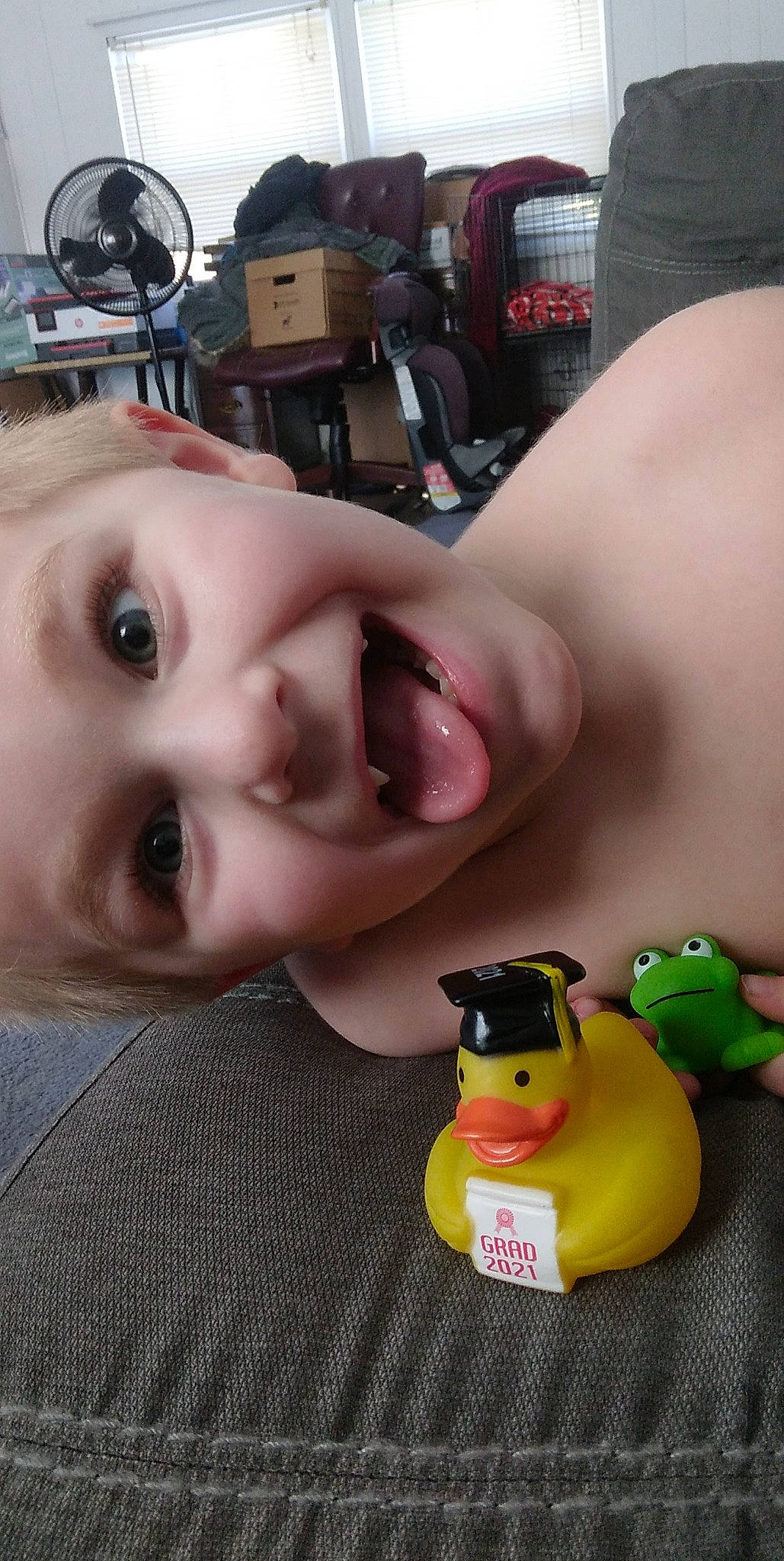 Derrick is registered to the contest to win money with this photo: baby, baby_products, bath_toy, cheek, child, eyebrow, eyelash, facial_expression, fun, headwear, lip, mouth, nose, person, plastic, rubber_ducky, selfie, skin, smile, toddler