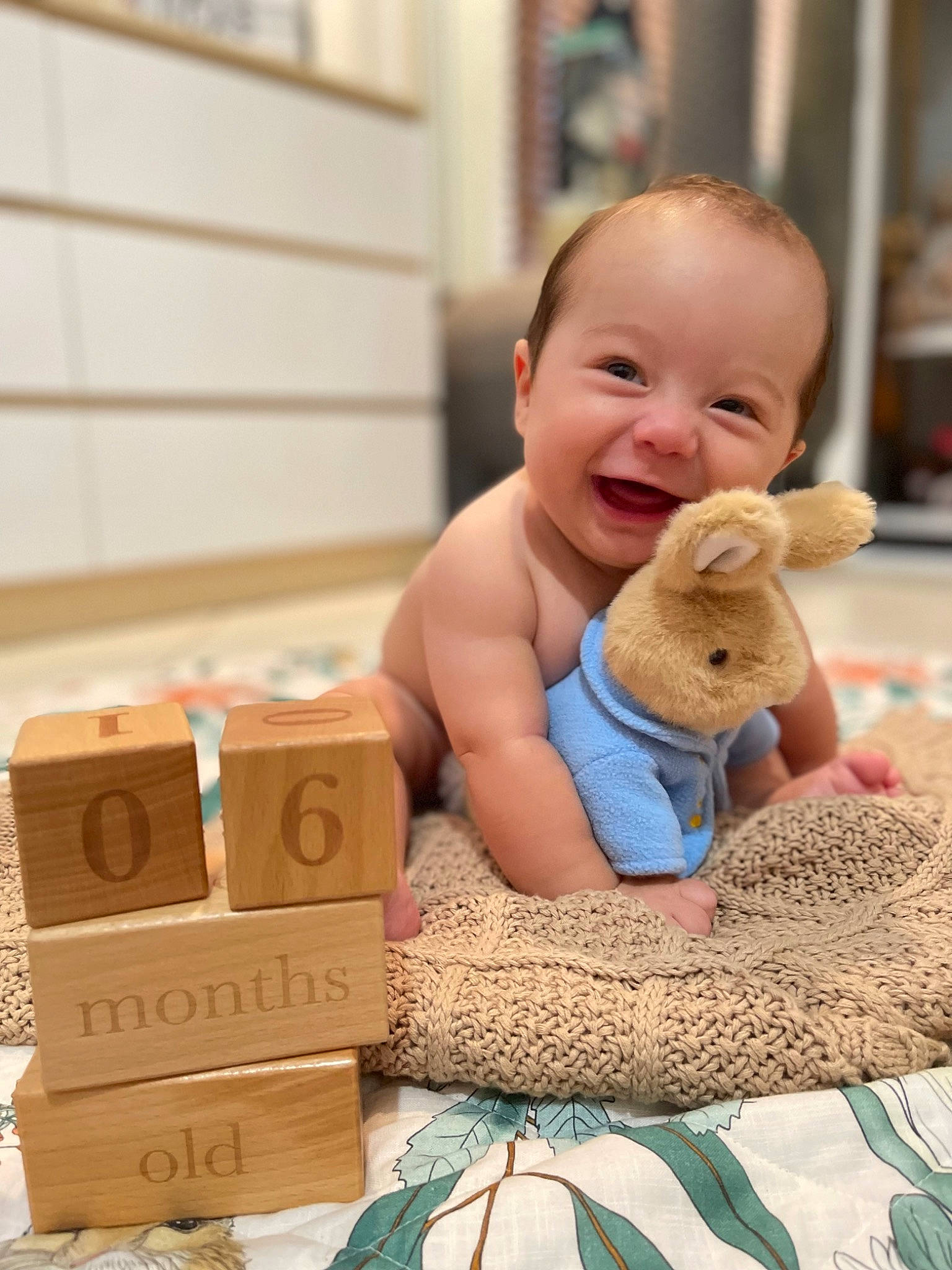 Malakai joined the competition — help win amazing prizes! baby, baby_playing_with_toys, baby_products, baby_toddler_clothing, box, cardboard, carton, child, comfort, flooring, fun, happy, joy, packaging_and_labeling, packing_materials, person, product, sitting, smile, toddler