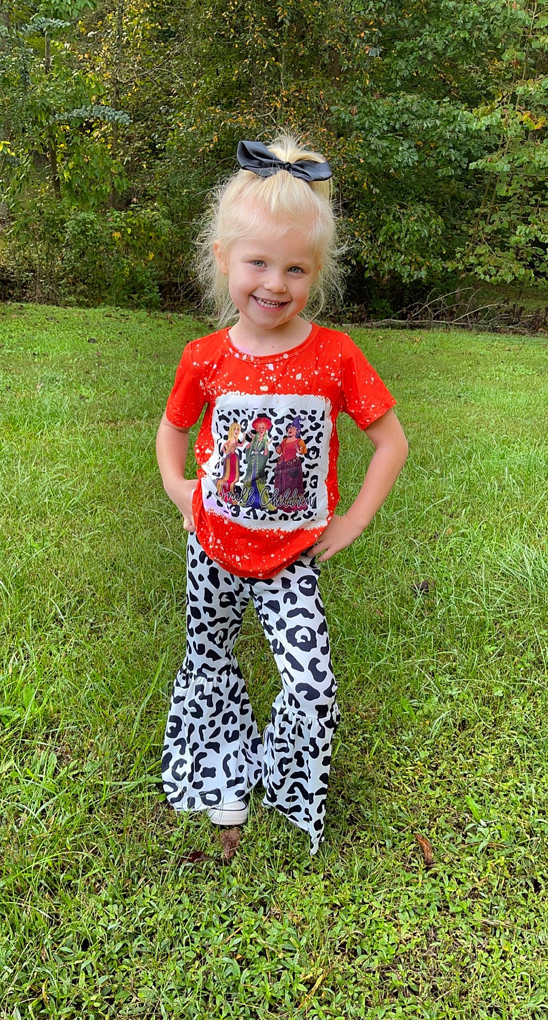 Raelyn is registered to the contest to win money with this photo: arm, baby_toddler_clothing, cool, goggles, grass, groundcover, hair, happy, head, joy, lawn, leg, pattern, people_in_nature, person, plant, sleeve, smile, summer, t_shirt