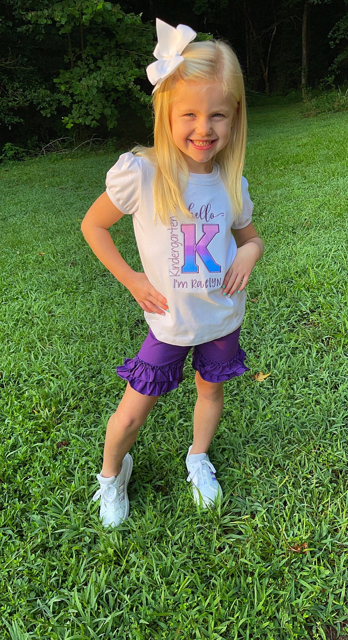 Raelyn is registered to the contest to win money with this photo: baby_toddler_clothing, blond, child, electric_blue, eye, fun, grass, happy, head, joy, lawn, light, people_in_nature, person, pink, plant, shorts, sleeve, smile, summer