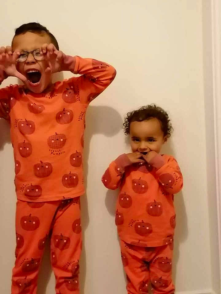 Kayden is registered to the contest to win money with this photo: arm, baby_toddler_clothing, chest, child, event, fashion_design, finger, fun, gesture, happy, joint, joy, neck, outerwear, person, shoulder, sleeve, smile, standing, toddler