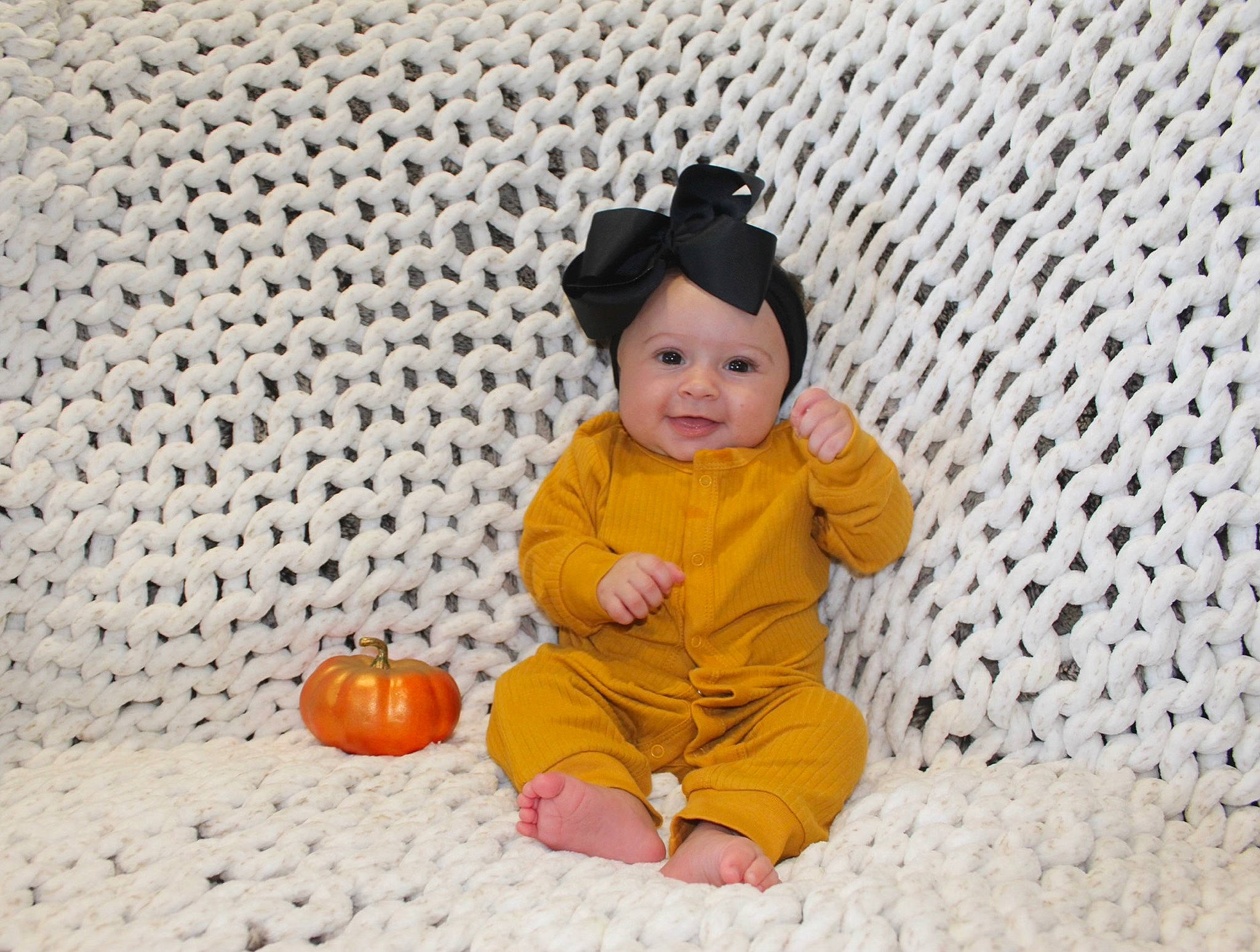 Adaleigh is registered to the contest to win money with this photo: baby, baby_toddler_clothing, baby_toys, cap, child, comfort, fashion_accessory, floor, flooring, fun, happy, hat, headwear, linens, pattern, person, sitting, sleeve, smile, sun_hat