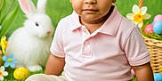Lucas is registered to the contest to win money with this photo: child, toddler, baby, sitting, grass, easter_basket, easter_eggs, bunny, stuffed_animal, tulips, flowers, portrait, green_background, pink_shirt, khaki_pants, brown_shoes, holiday_photo, studio_shot, cute, innocent