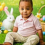 child, toddler, baby, sitting, grass, easter_basket, easter_eggs, bunny, stuffed_animal, tulips, flowers, portrait, green_background, pink_shirt, khaki_pants, brown_shoes, holiday_photo, studio_shot, cute, innocent