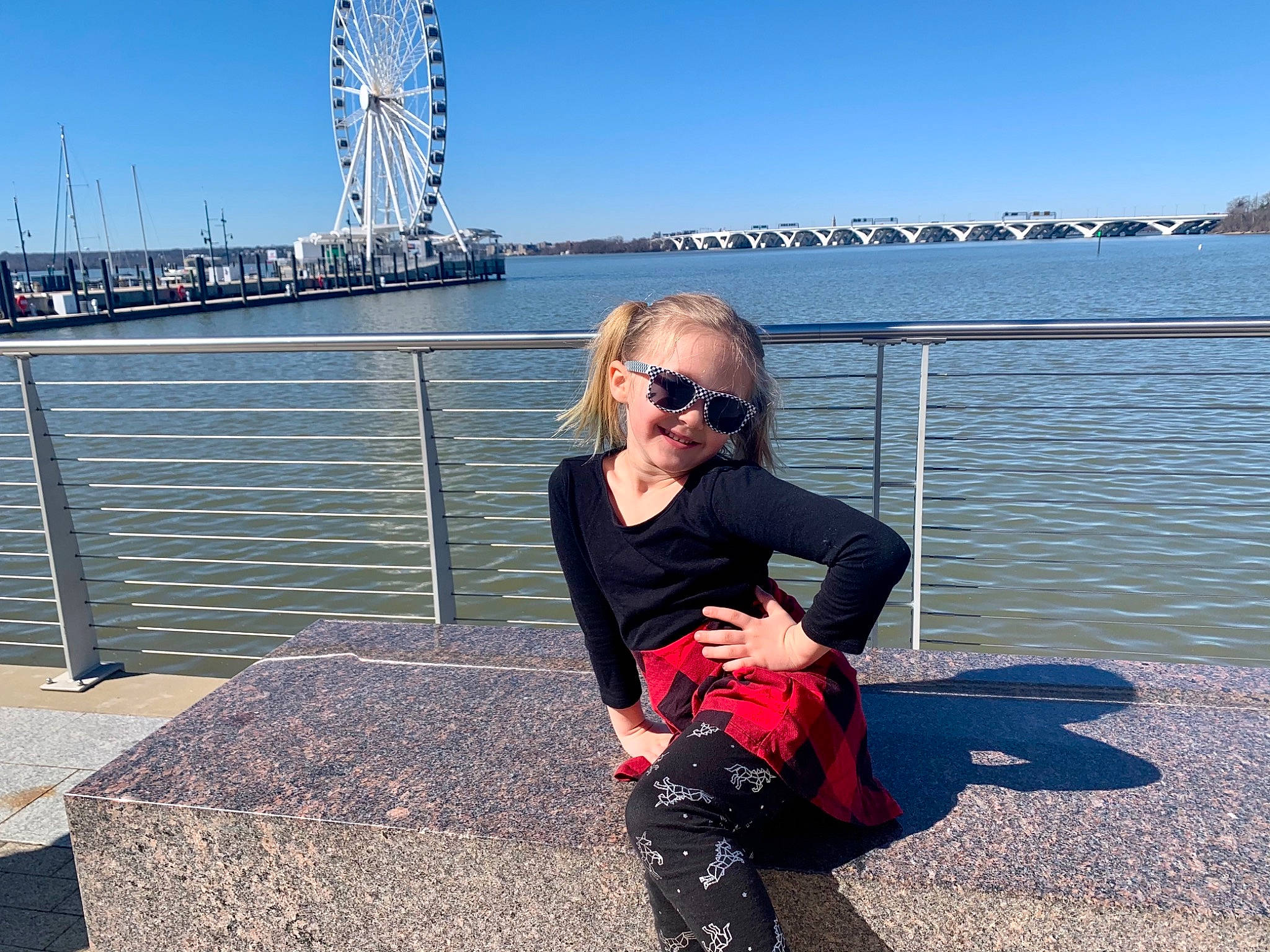 Alexia joined the competition — help win amazing prizes! bridge, city, eyewear, fence, glasses, goggles, happy, horizon, human_leg, joy, knee, leisure, luggage_and_bags, metal, person, sky, street_fashion, sunglasses, thigh, travel