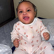 Baby Icey is registered to the contest to win money with this photo: baby, child, pajamas, bed, blanket, smile, happy, face, person, indoor, infant, cute, cozy, sleepwear, young, sitting, room, comfort, expression, joy