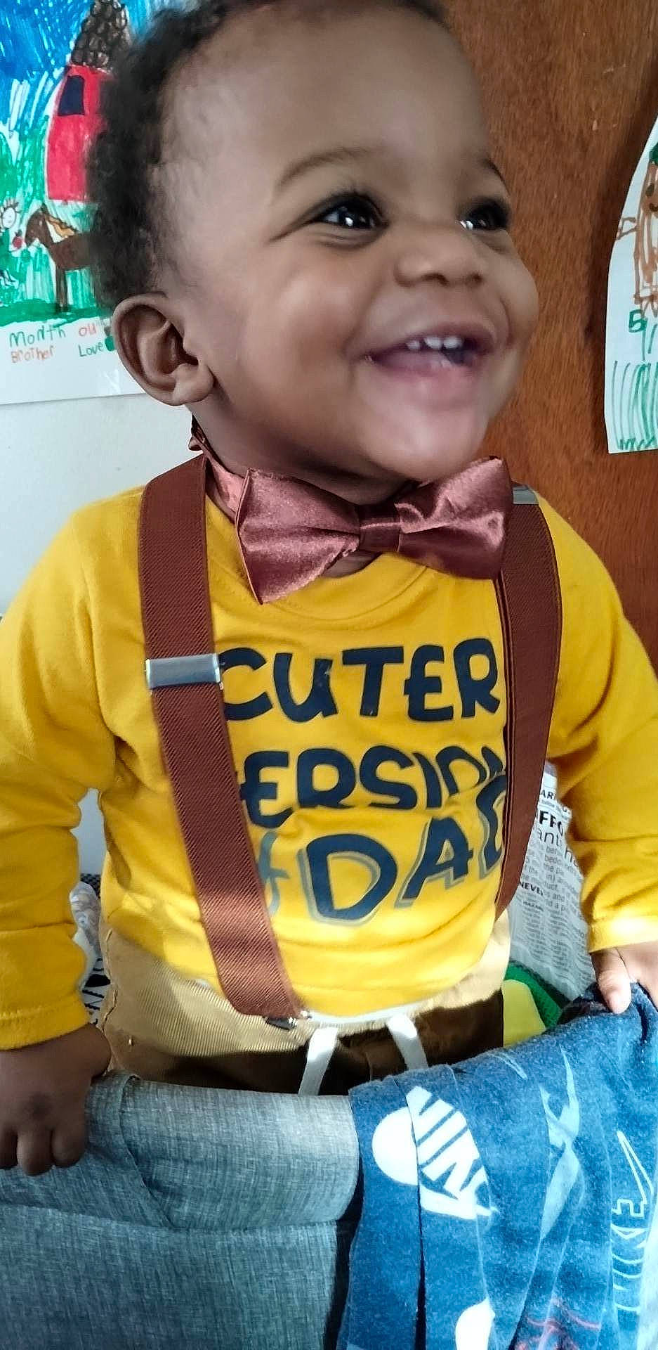 Derrick is registered to the contest to win money with this photo: baby, baby_laughing, baby_toddler_clothing, child, clothing, cool, fun, green, happy, joy, logo, neck, nose, organ, person, selfie, skin, sleeve, smile, t_shirt