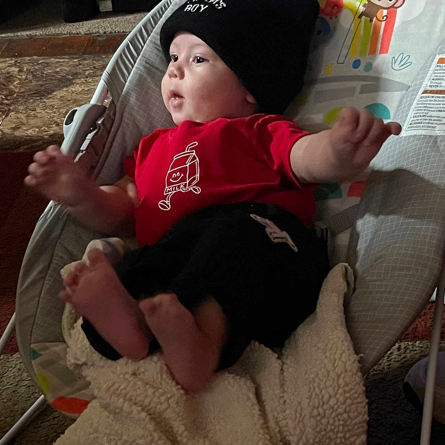 Tremoni joined the competition — help win amazing prizes! baby, baby_seat, beanie, blanket, carpet, child, clothing, comfort, cute, face, foot, hand, indoor, infant, milk_carton_design, monkey_graphic, pattern, red_shirt, relaxing, toy_design