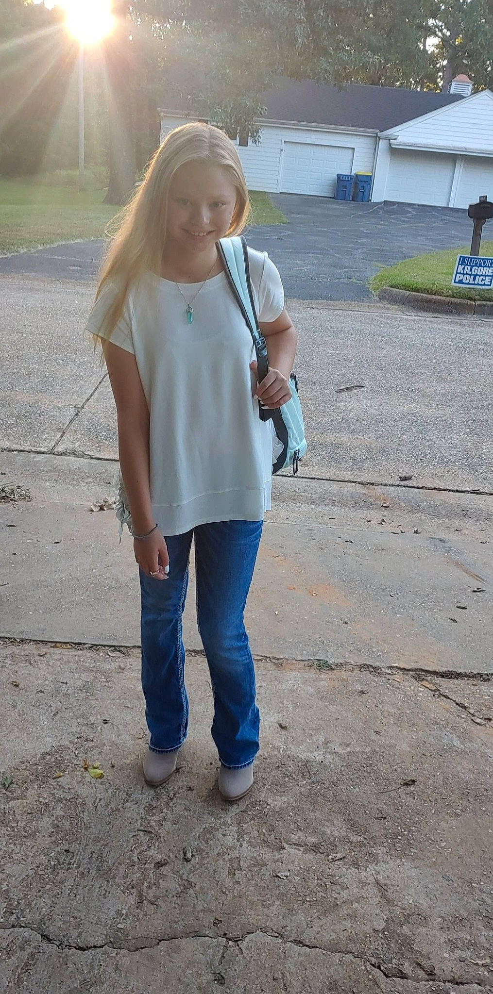 Maddyson is registered to the contest to win money with this photo: asphalt, bag, bench, blazer, denim, electric_blue, eyewear, grey, hairstyle, human_leg, joy, knee, long_hair, person, road_surface, shoulder, sleeve, sportswear, street_fashion, t_shirt