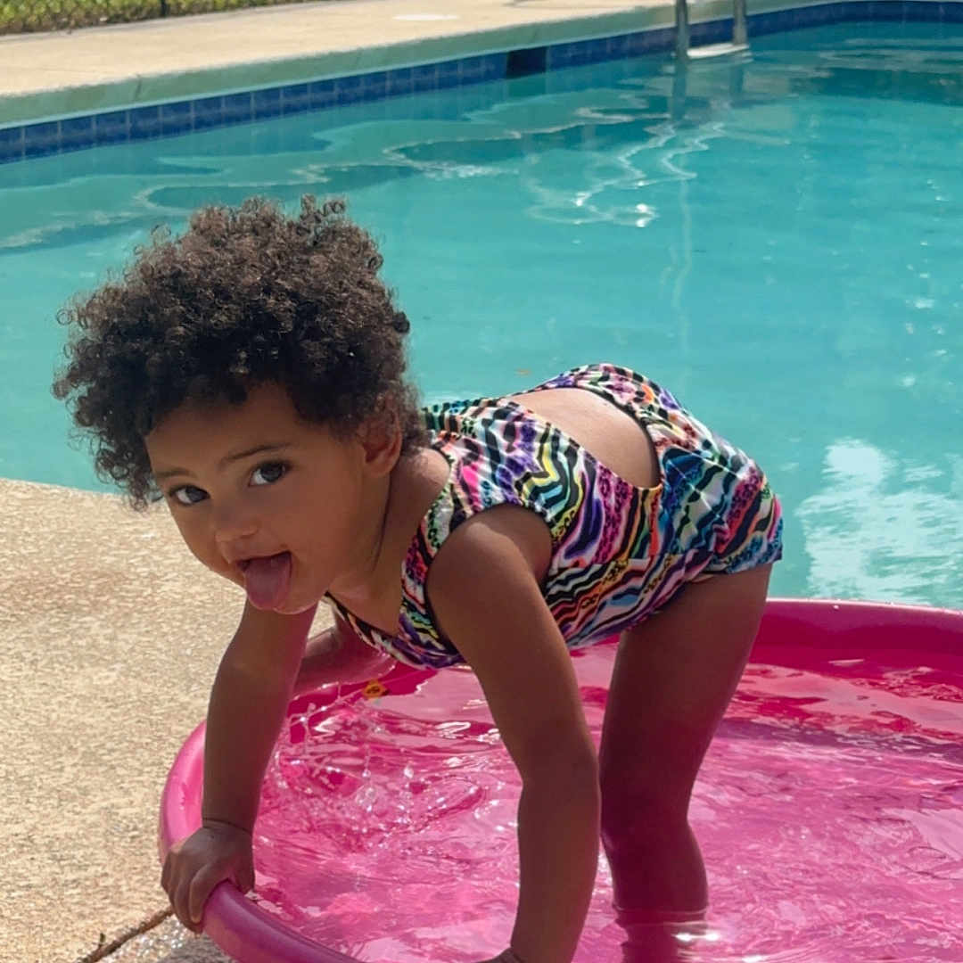 Elaina Rae joined the competition — help win amazing prizes! amusementpark, child, clothing, face, female, girl, head, leisureactivities, person, photography, pool, portrait, shorts, sport, summer, swimming, swimmingpool, swimwear, water, watersports