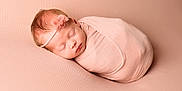 Marnie is registered to the contest to win money with this photo: newborn, baby, sleeping, pink, blanket, headband, wrapped, infant, soft, peaceful, cute, portrait, child, bed, resting, cozy, closeup, toddler, head, face