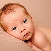 Marnie is registered to the contest to win money with this photo: baby, infant, face, eyes, skin, hair, portrait, closeup, newborn, resting, soft_lighting, cute, child, expression, looking, lying_down, young, peaceful, human, baby_skin