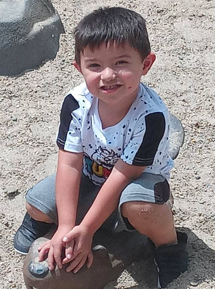 Josiah is registered to the contest to win money with this photo: automotive_tire, elbow, eye, flash_photography, fun, grass, hair, happy, head, human_body, human_leg, joy, knee, leg, leisure, mouth, person, sleeve, smile, t_shirt