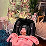 Maelys joined the competition — help win amazing prizes! baby, blanket, car_seat, carpet, christmas_tree, cozy, cute, festive, holiday, holiday_decorations, indoor, newborn, nutcracker, ornaments, pink_bows, pink_clothing, plant, sleeping, snowman, wood_floor