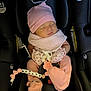 Maelys joined the competition — help win amazing prizes! baby, baby_accessories, car_seat, child, clothing, comfort, cute, indoor, infant, mittens, newborn, pacifier_clip, peaceful, pink_hat, portrait, resting, seat_belt, sleeping, small_person, soft_toys