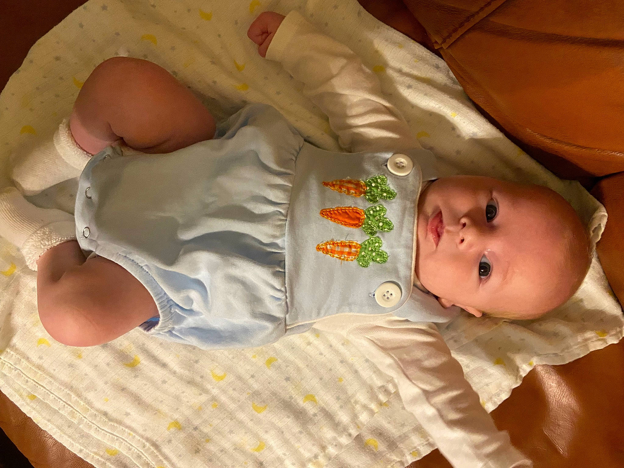 Walker is registered to the contest to win money with this photo: baby, baby_products, baby_safety, baby_toddler_clothing, cheek, child, comfort, finger, foot, linens, nail, person, room, sitting, skin, sleeve, smile, textile, thumb, toddler