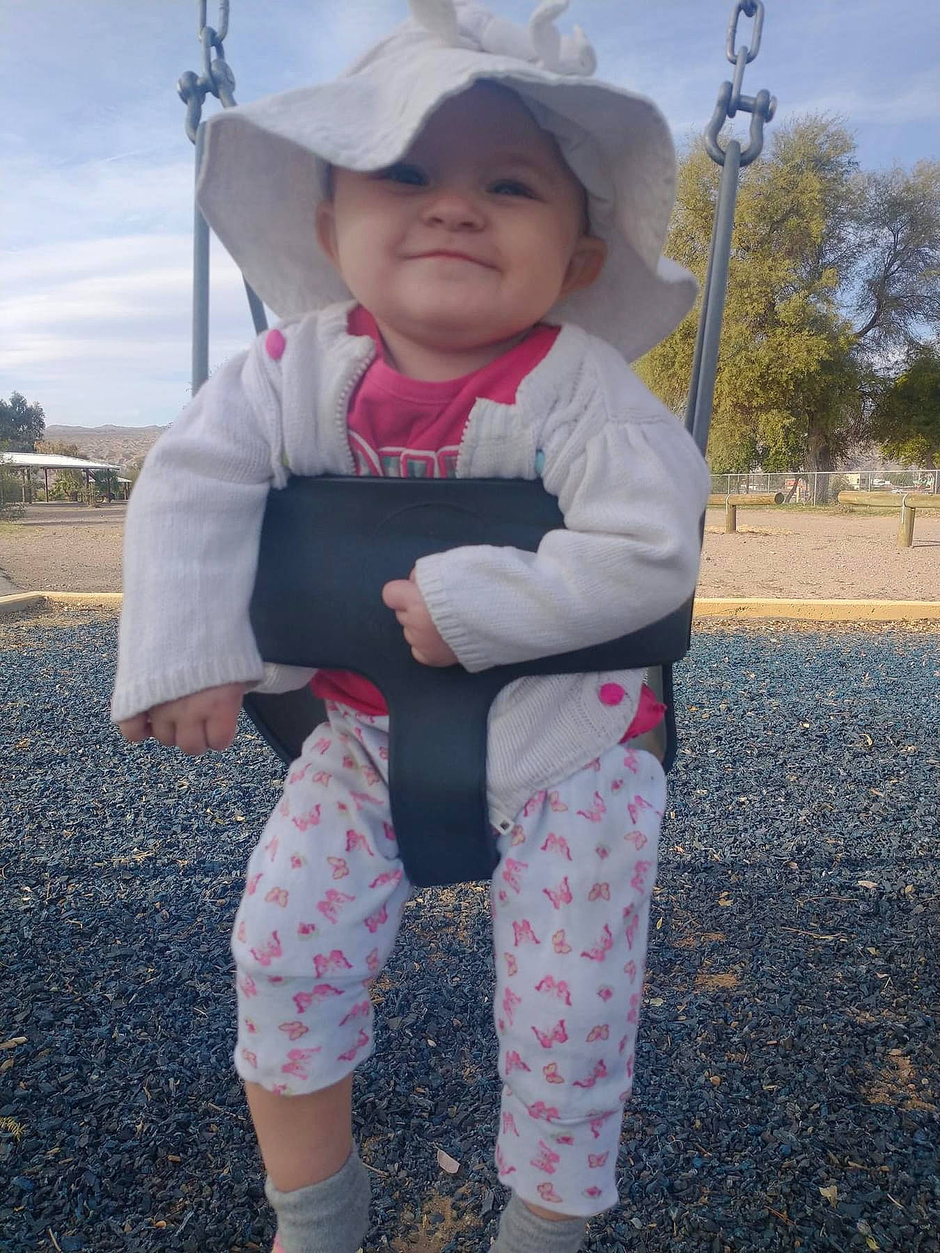 Desiree is registered to the contest to win money with this photo: baby, baby_toddler_clothing, child, city, cloud, cool, fashion_accessory, fun, grass, happy, hat, headwear, joy, pattern, person, pink, sky, sleeve, sock, sun_hat