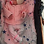 baby, blanket, child, comfort, cozy, cushion, cute, headband, indoor, infant, newborn, pacifier, pink_clothing, plush_toy, resting, sleeping, soft, star_pattern, stroller, white_clothing