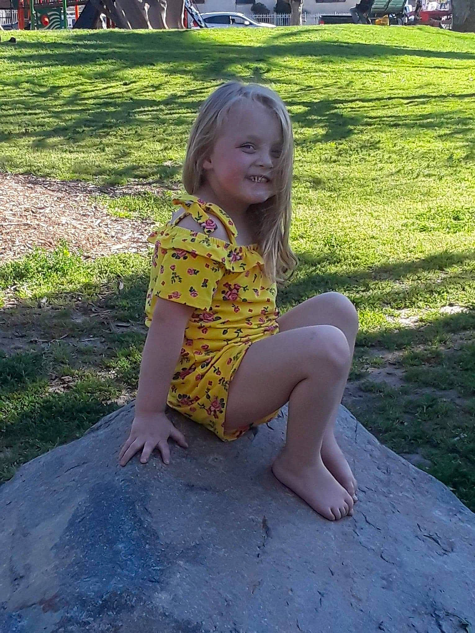 Kodie joined the competition — help win amazing prizes! fawn, grass, joy, leg, long_hair, person, sitting