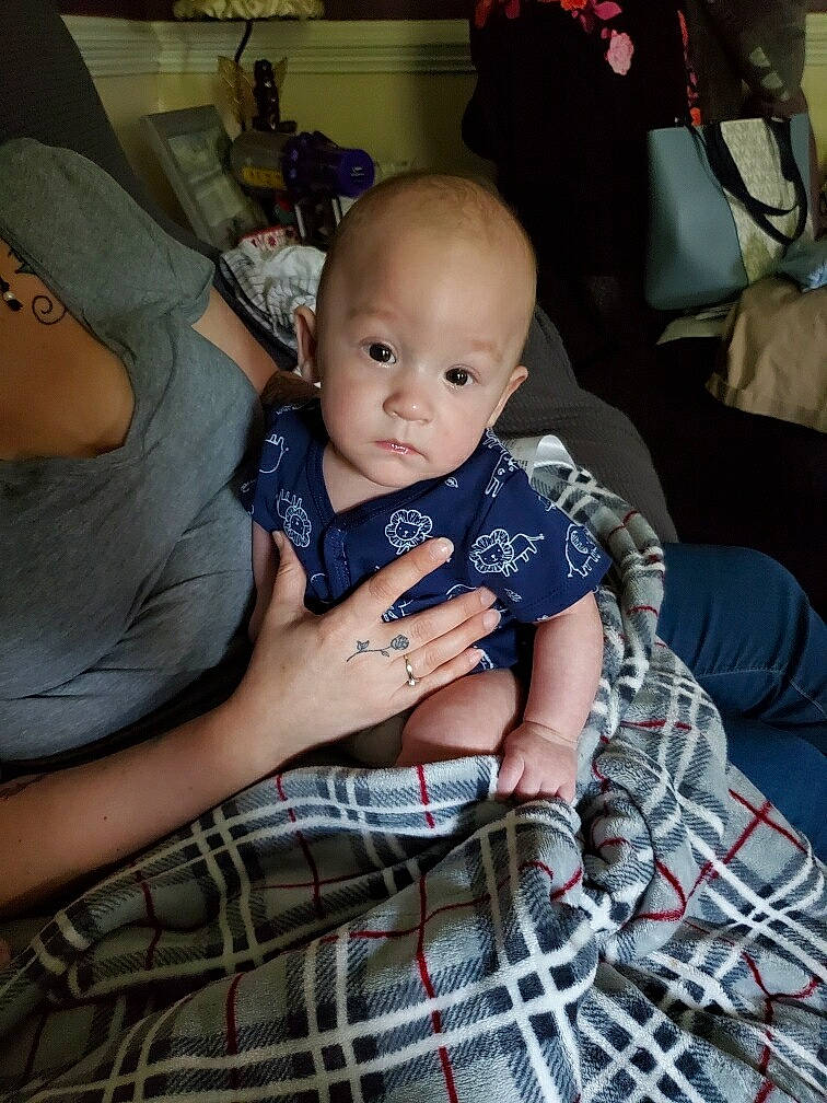 Layne joined the competition — help win amazing prizes! arm, baby, baby_toddler_clothing, cheek, child, comfort, event, fun, iris, lap, pattern, person, plaid, room, sitting, smile, t_shirt, tartan, thigh, toddler