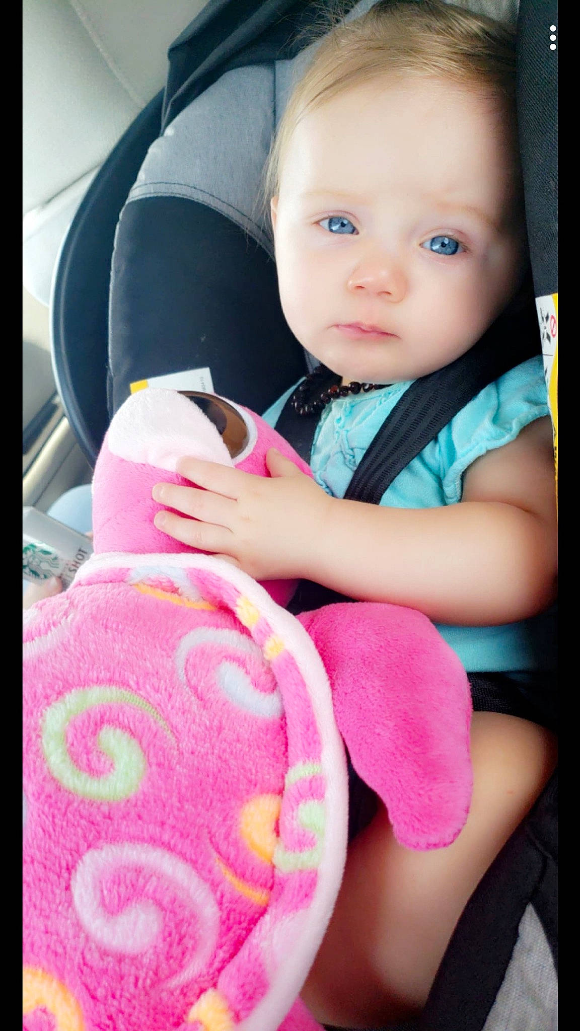 Blakeleigh is registered to the contest to win money with this photo: auto_part, baby, baby_in_car_seat, baby_products, baby_toys, car_seat, cheek, child, person, pink, play, product, skin, stuffed_toy, toddler