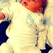 Huxley is registered to the contest to win money with this photo: architecture, baby, bed, blanket, building, clothing, cushion, face, furniture, glove, head, homedecor, hospital, newborn, pants, person, photography, portrait, quilt, sleeping