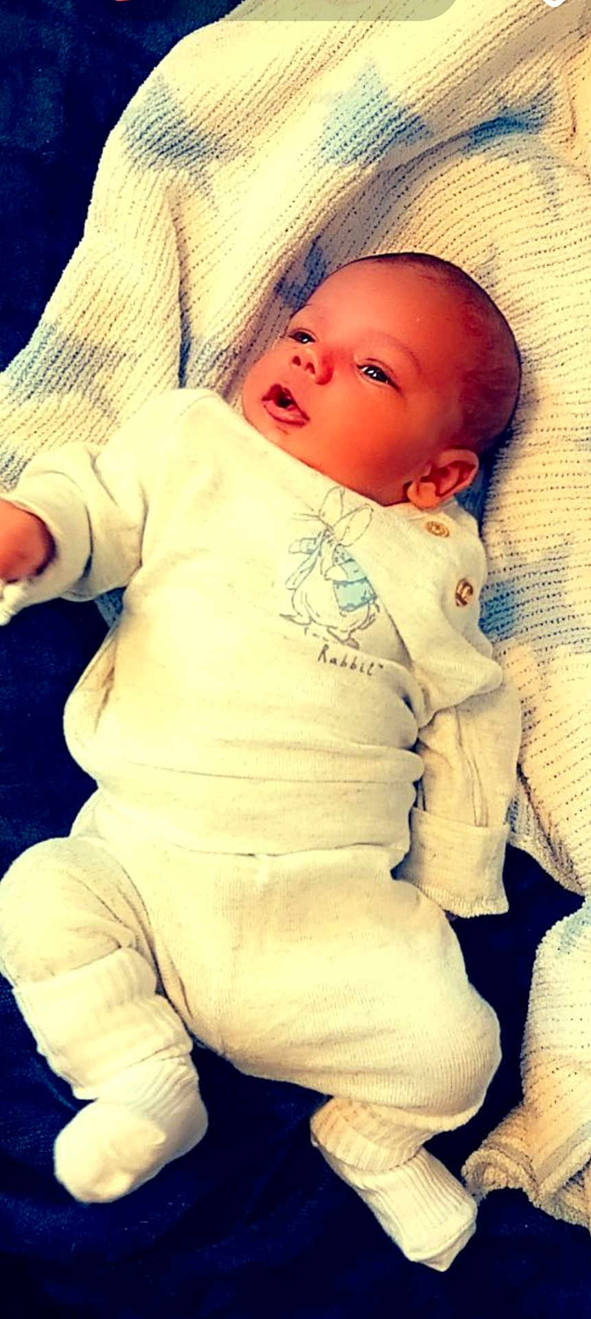 Huxley is registered to the contest to win money with this photo: architecture, baby, bed, blanket, building, clothing, cushion, face, furniture, glove, head, homedecor, hospital, newborn, pants, person, photography, portrait, quilt, sleeping