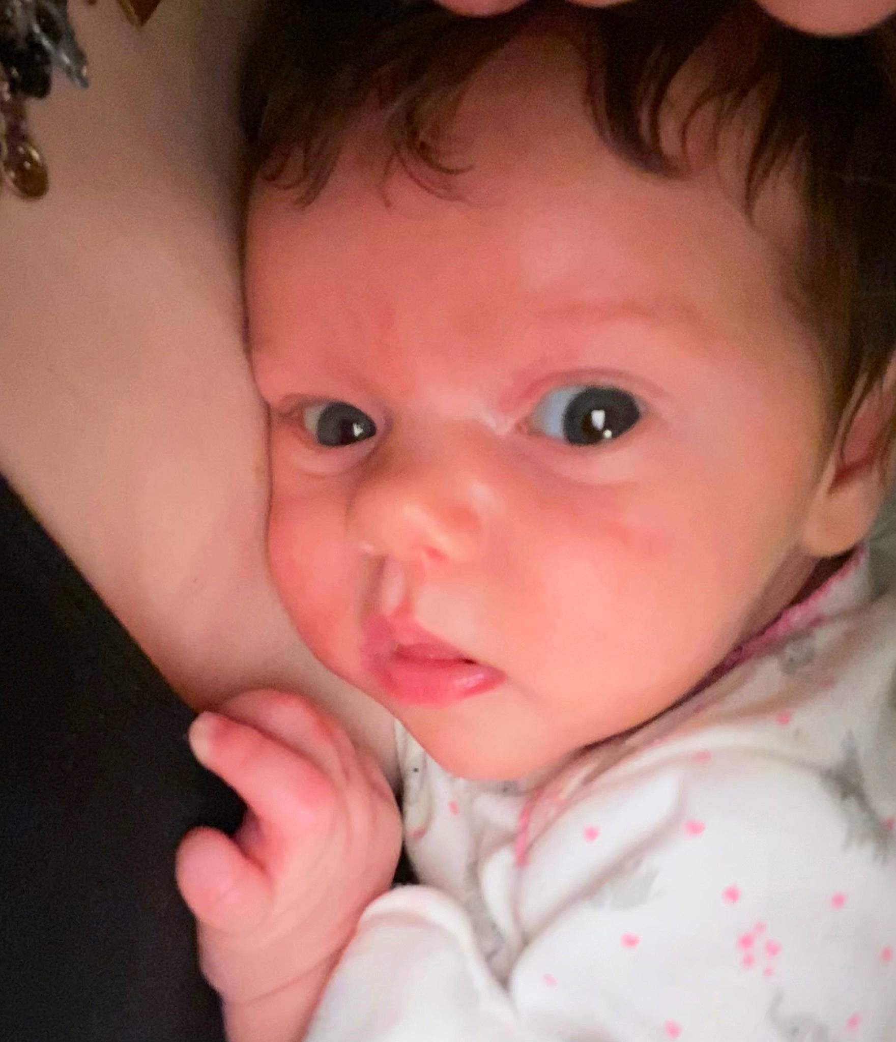 Isla is registered to the contest to win money with this photo: baby, cheek, chin, ear, eye, eyebrow, eyelash, facial_expression, forehead, gesture, hair, hand, head, iris, lip, mouth, neck, nose, organ, person