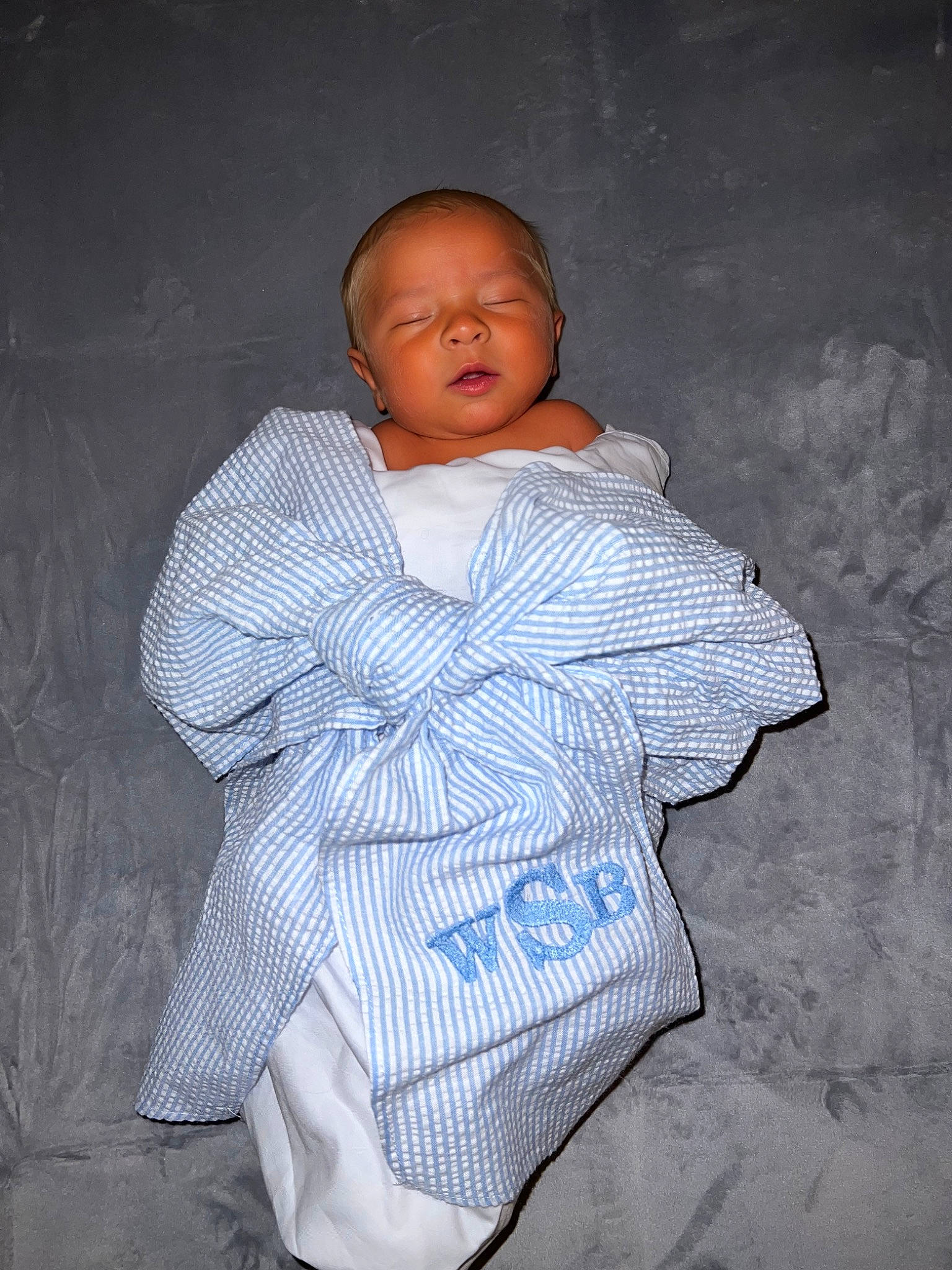 Bennett is registered to the contest to win money with this photo: arm, baby, baby_toddler_clothing, cheek, child, comfort, darkness, flash_photography, fun, happy, linens, pattern, person, portrait_photography, room, sitting, sleeve, smile, t_shirt, toddler