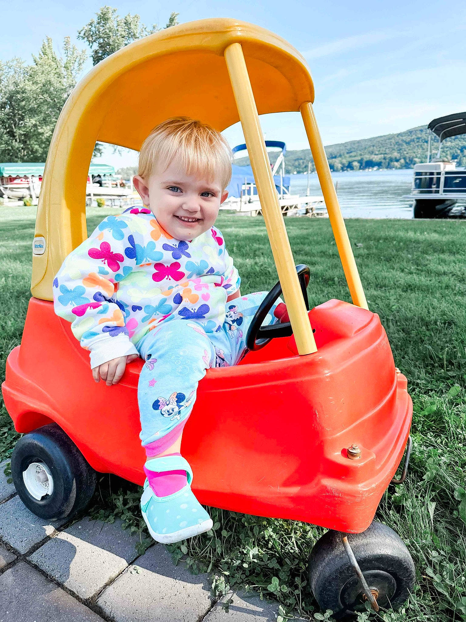 Delilah joined the competition — help win amazing prizes! automotive_wheel_system, baby, baby_toddler_clothing, child, city, cloud, fun, grass, joy, leisure, person, play, product, recreation, riding_toy, sky, smile, tire, toddler, tree