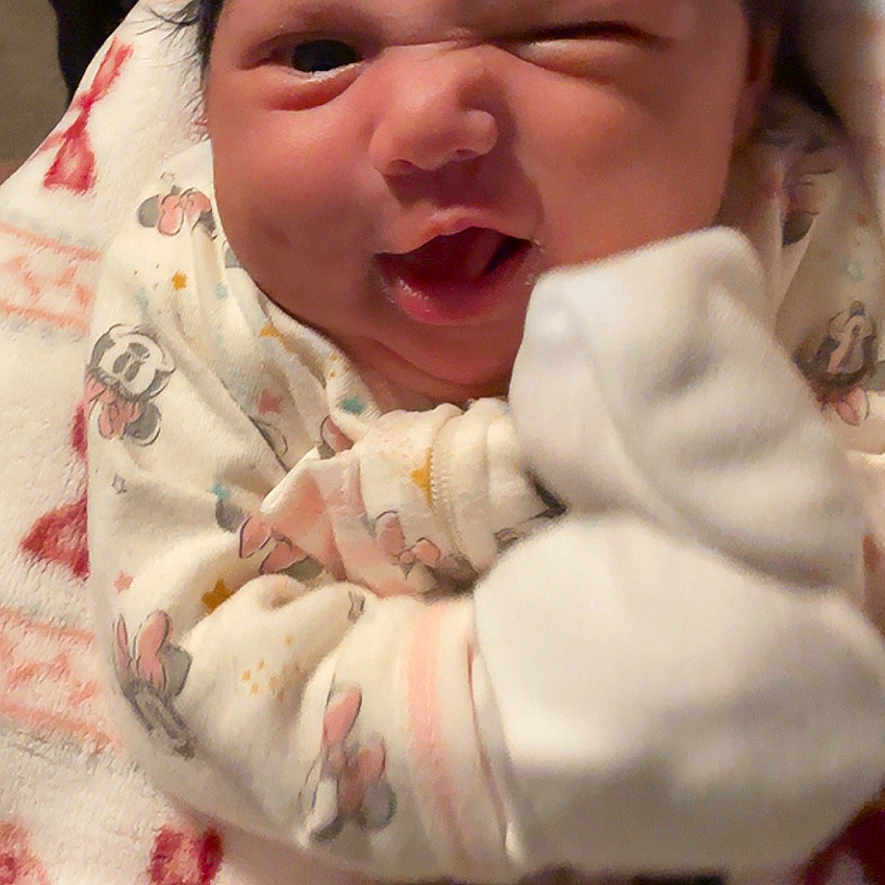 Eleni joined the competition — help win amazing prizes! baby, blanket, bodypart, bonnet, bread, clothing, face, finger, food, glove, hand, hat, head, mouth, newborn, person, photography, portrait, quilt, towel