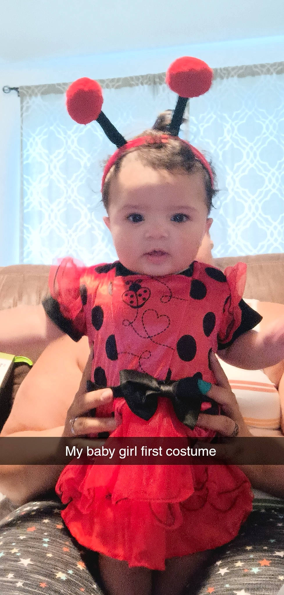 Rory is registered to the contest to win money with this photo: abdomen, baby, baby_toddler_clothing, child, event, eye, face, happy, head, orange, organ, pattern, person, pink, red, skin, sleeve, textile, thigh, toddler