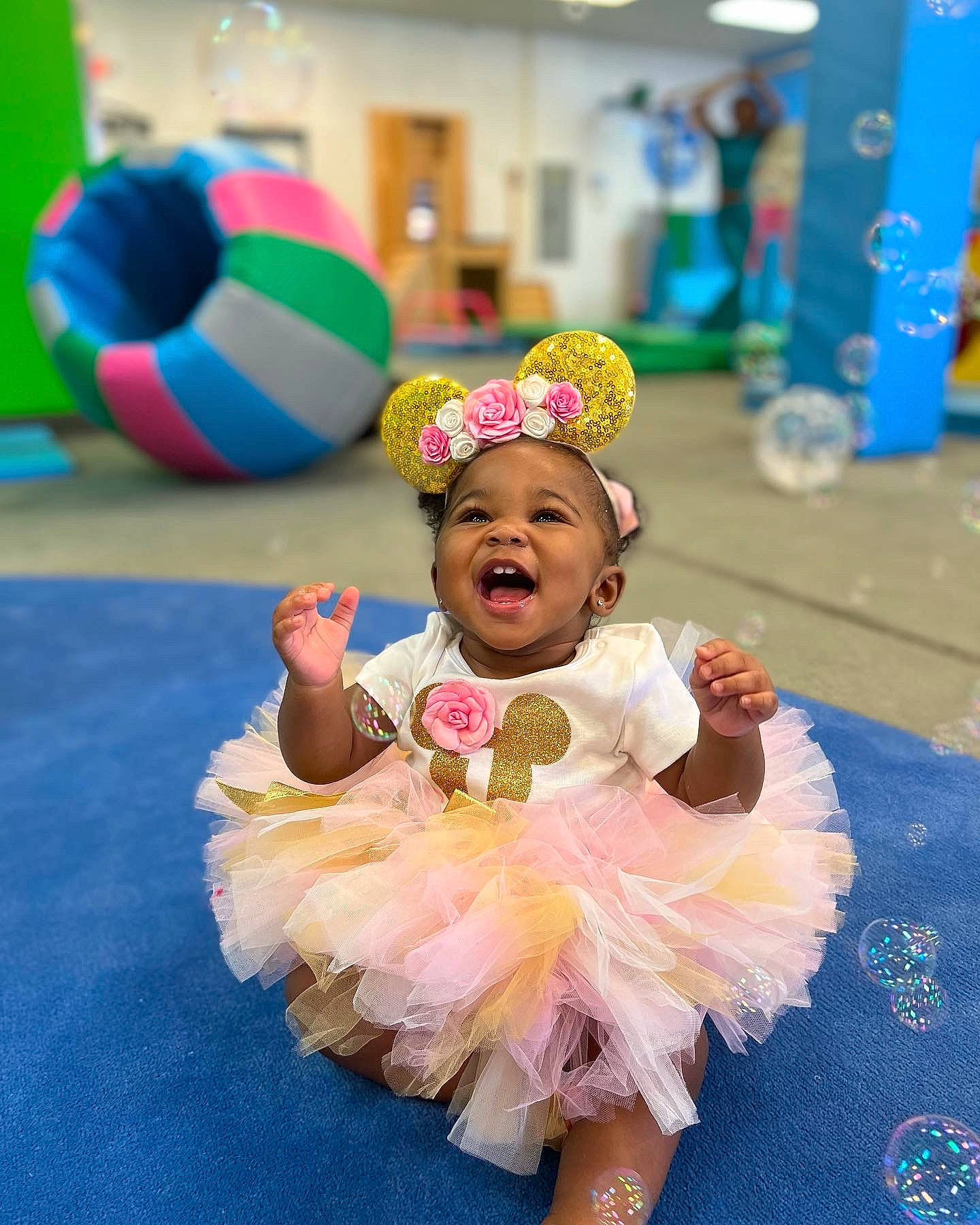 Egypt is registered to the contest to win money with this photo: baby, ball, child, entertainment, event, flooring, fun, happy, hat, headpiece, leisure, party, party_supply, performing_arts, person, play, recreation, room, smile, toddler