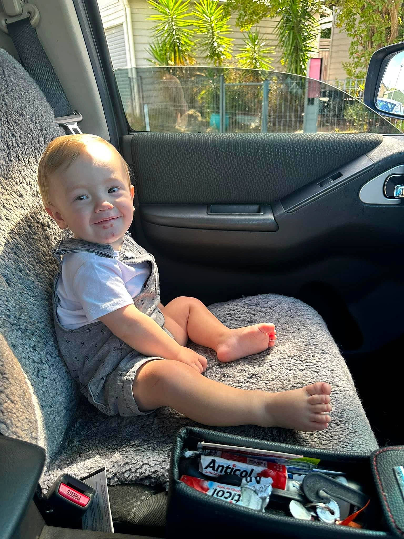 Isaiah is registered to the contest to win money with this photo: auto_part, automotive_design, automotive_exterior, automotive_lighting, baby_toddler_clothing, car, comfort, family_car, fun, joy, leisure, motor_vehicle, person, personal_luxury_car, plant, product, smile, steering_wheel, toddler, vehicle