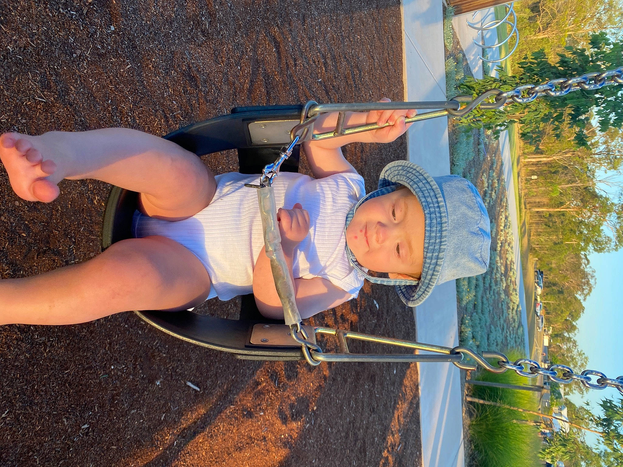 Isaiah joined the competition — help win amazing prizes! adventure, electric_blue, fun, grass, hat, headwear, human_leg, knee, landscape, leisure, person, recreation, shooting, shorts, sky, soil, sun_hat, thigh, toddler, tree
