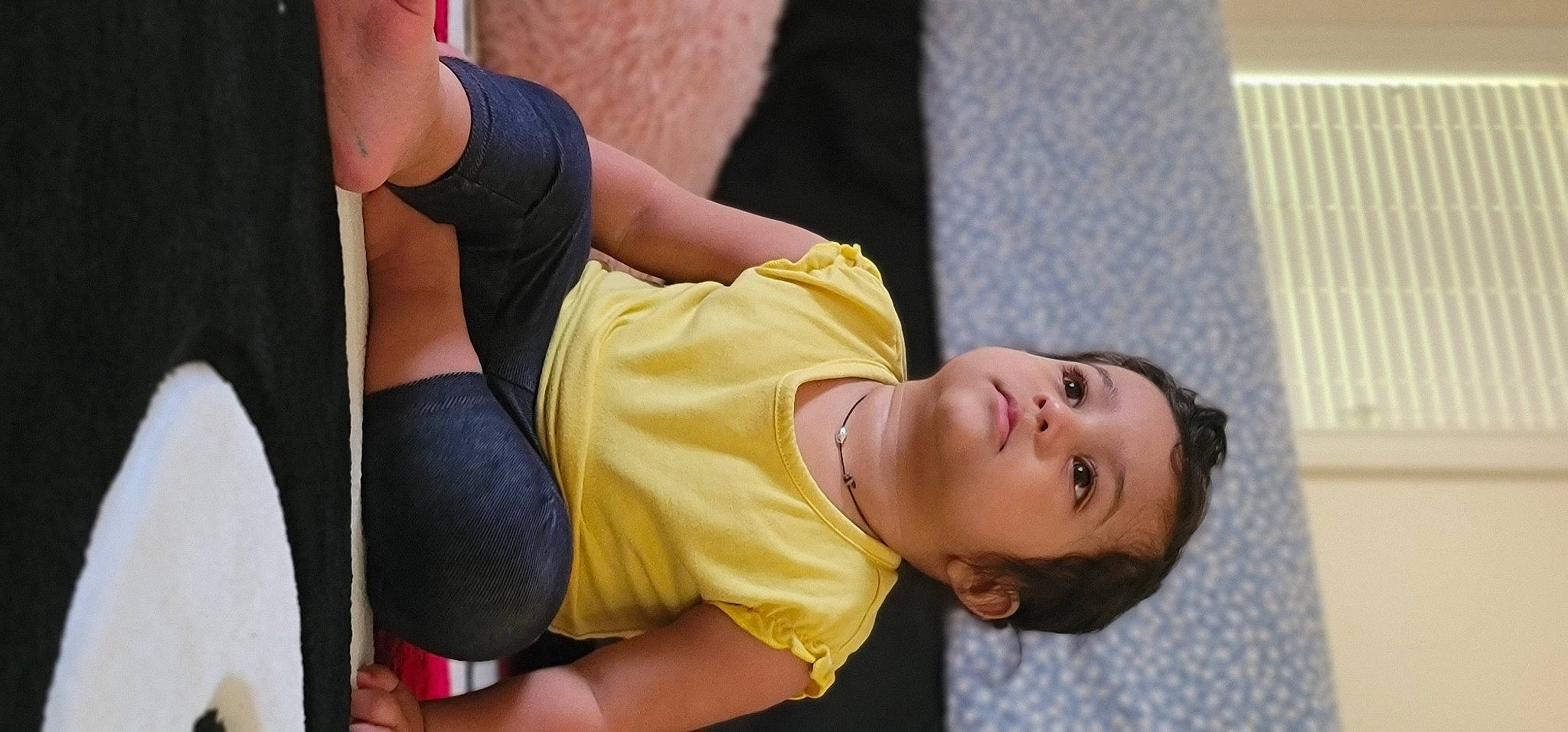 Rylee is registered to the contest to win money with this photo: abdomen, chest, child, elbow, entertainment, event, foot, fun, human_leg, joint, knee, leisure, person, physical_fitness, recreation, sitting, sportswear, t_shirt, thigh, trunk