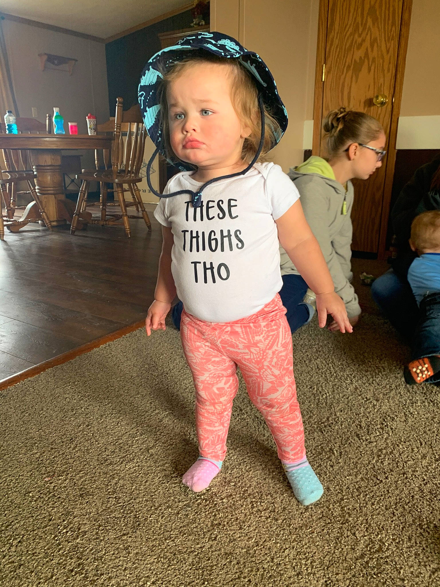 Estelle joined the competition — help win amazing prizes! cheek, child, cool, costume, floor, flooring, fun, head, joint, leg, person, shoulder, sleeve, standing, t_shirt, toddler