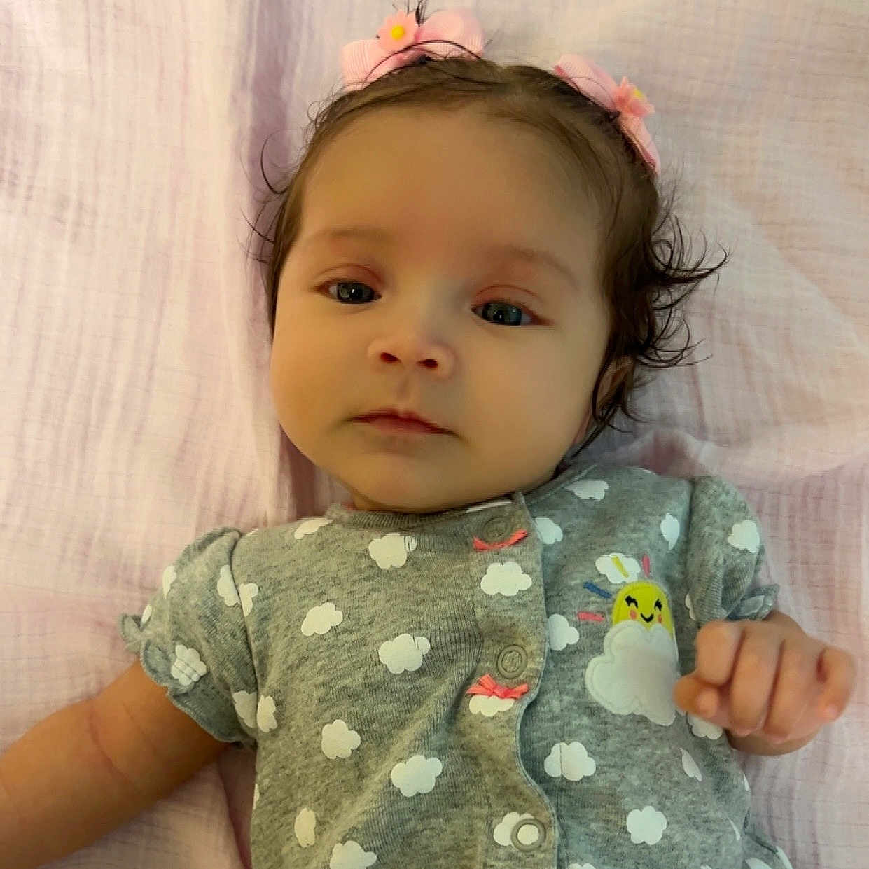Arielynn joined the competition — help win amazing prizes! adorable, baby, blanket, child, clothing, cloud_pattern, cute, face, grey, hair, hand, headwear, indoors, infant, lying_down, peaceful, pink, portrait, soft_texture, sun_patch
