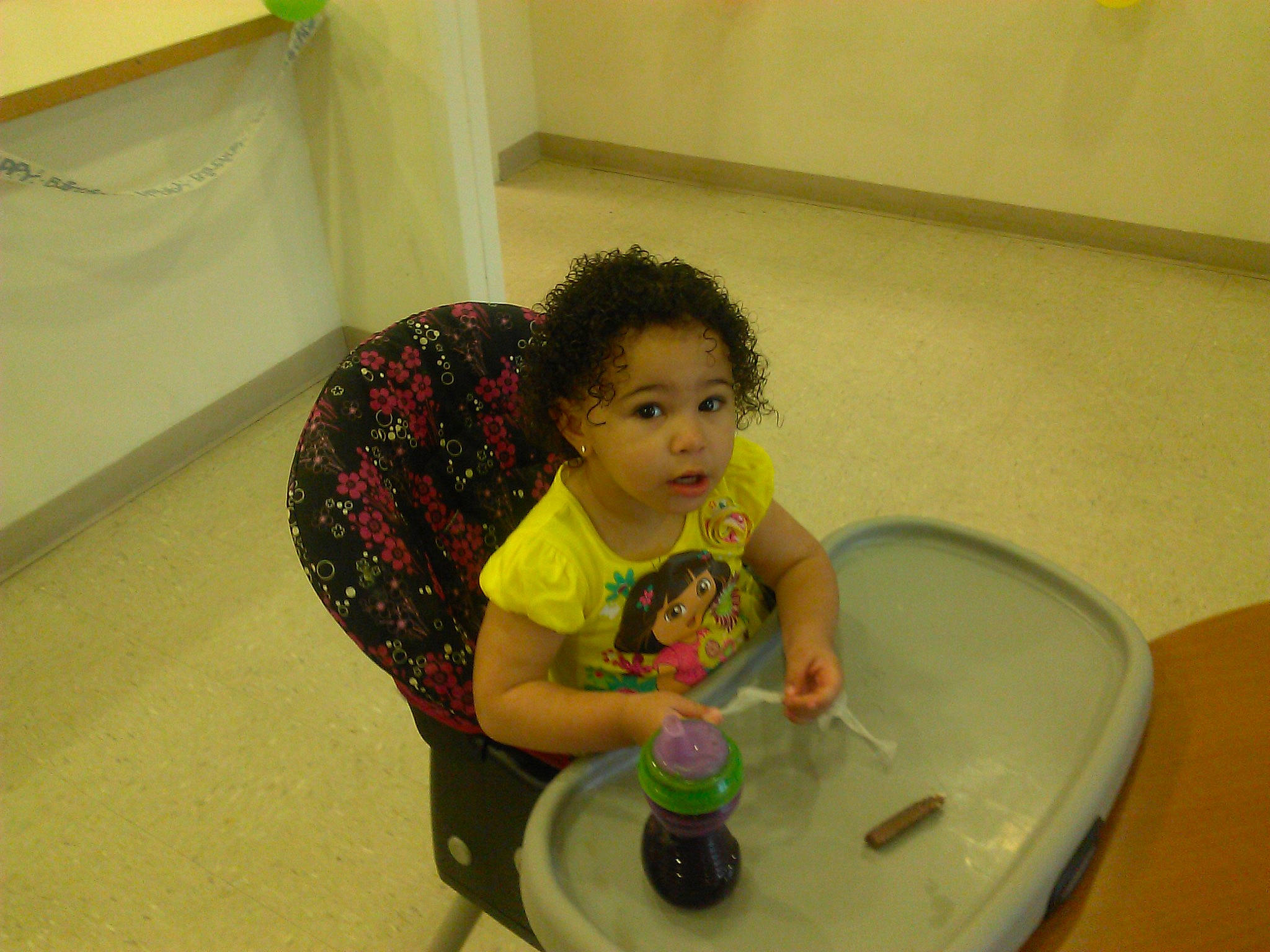 Ashlynn is registered to the contest to win money with this photo: baby, baby_toddler_clothing, bathing, child, circle, flooring, fun, leisure, person, plastic, play, room, sitting, sleeve, t_shirt, table, toddler